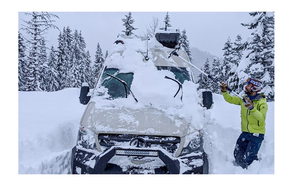 Winnebago Revel being dug out of deep snow.