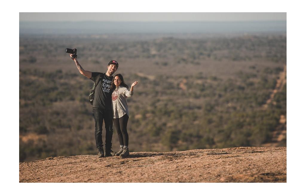 Nadia and Jon posing outside at night at the RVE Summit