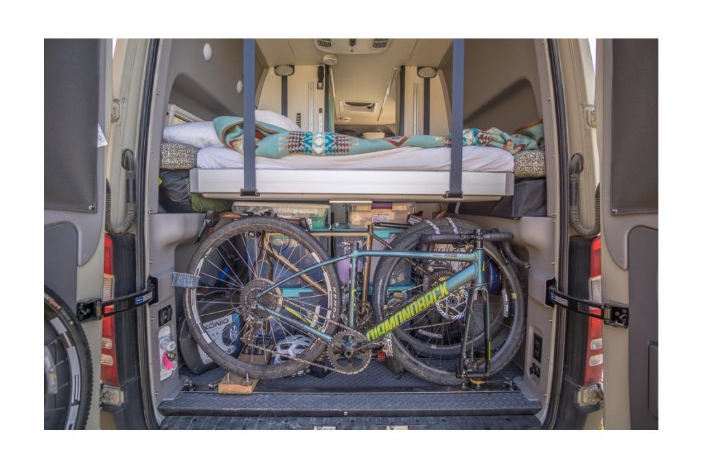 Exterior rear view of Winnebago Revel power lift bed and gear garage