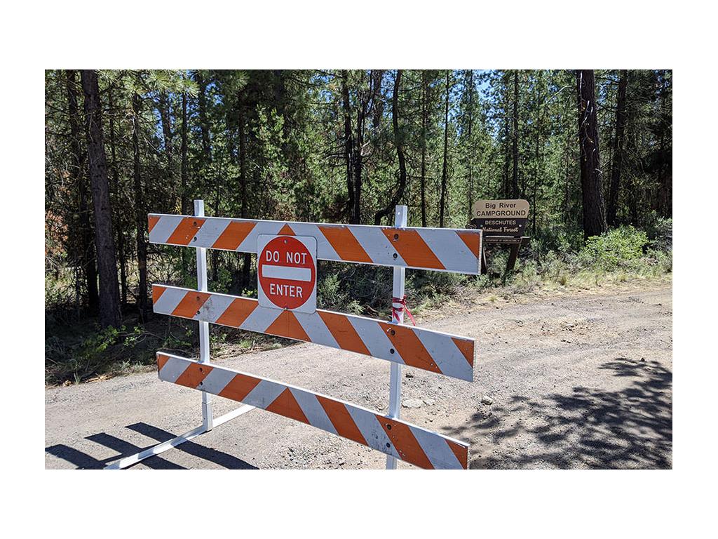 Barricaded road of closed campground