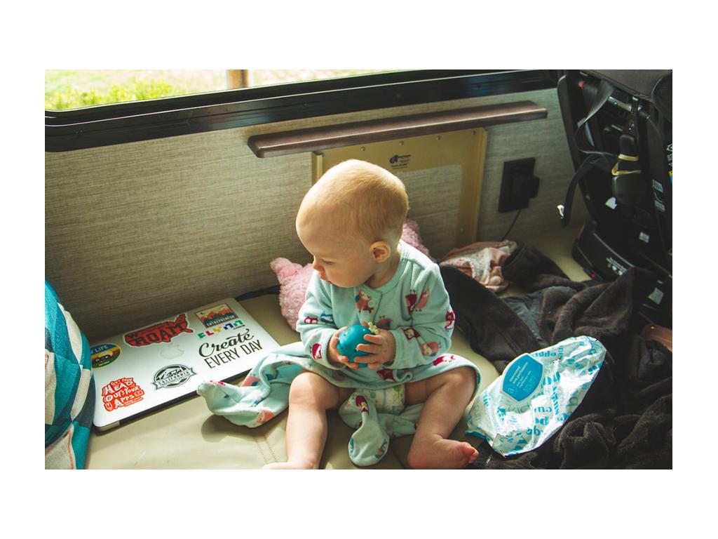 Ellie sitting of Forza sofa holding a toy
