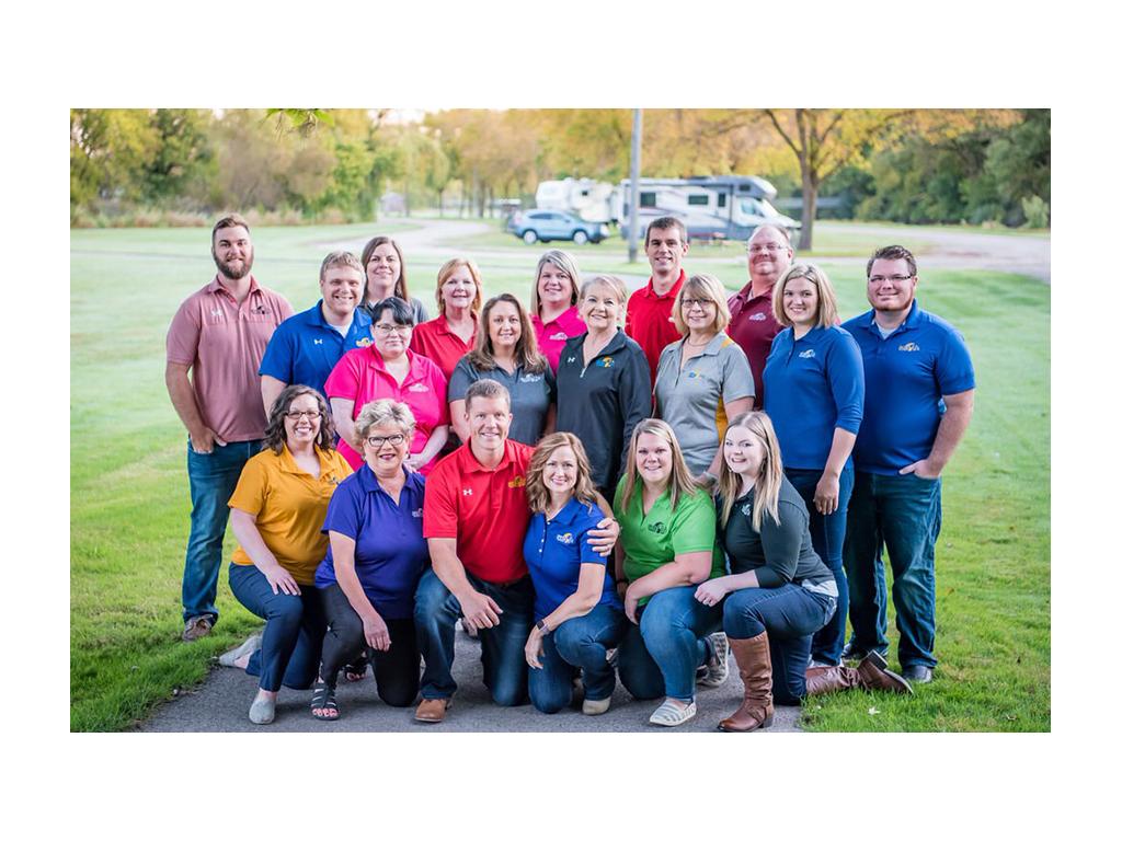 FCIS insurance team huddled together for a photo outside