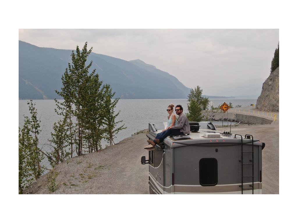 Newstates sitting on top of Navion overlooking water