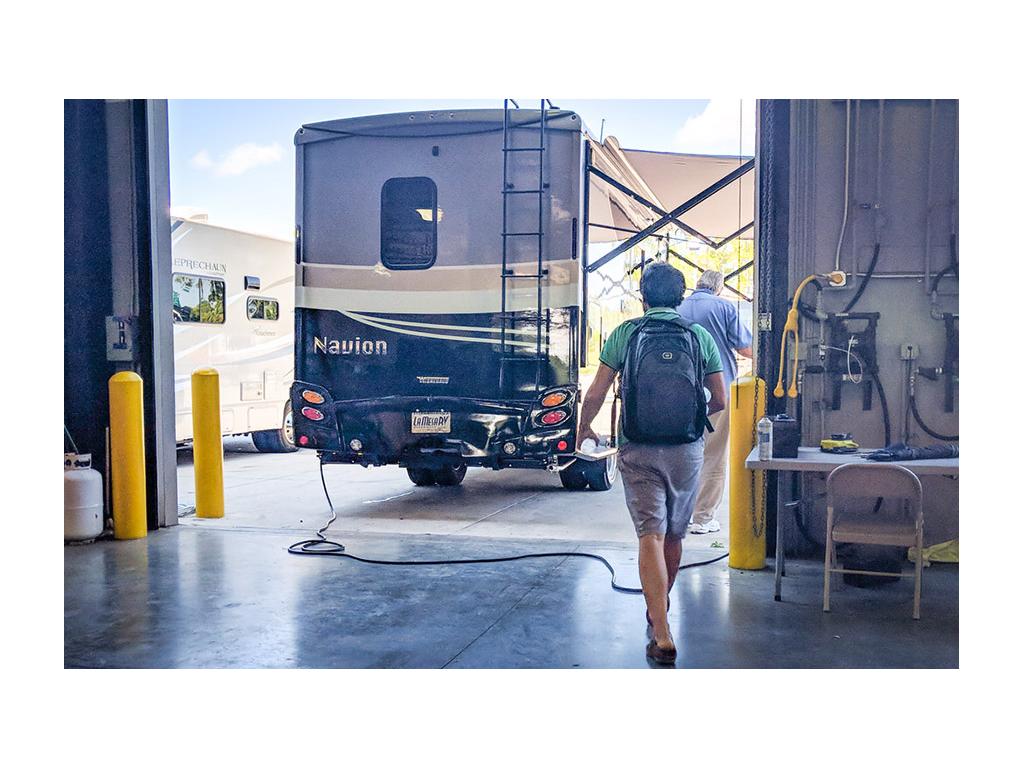 Howard walking towards Navion in service bay
