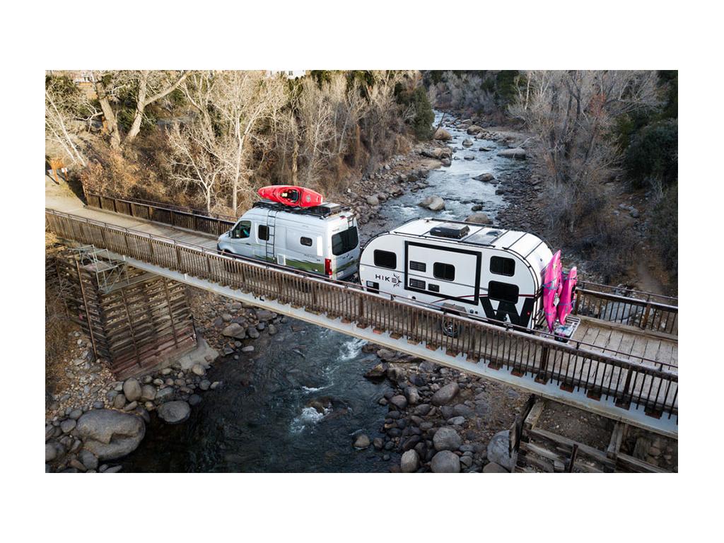 Revel pulling HIKE across bridge over water