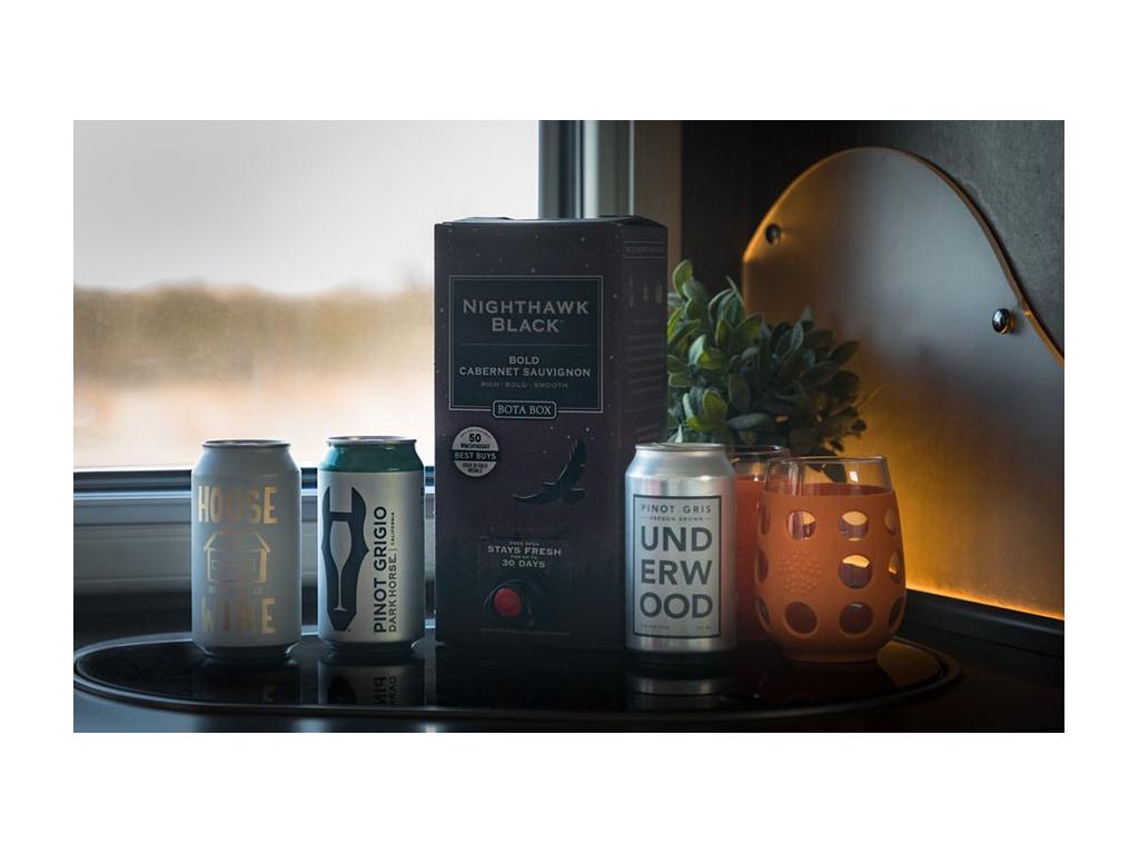 Canned and boxed wine sitting on countertop in Trend