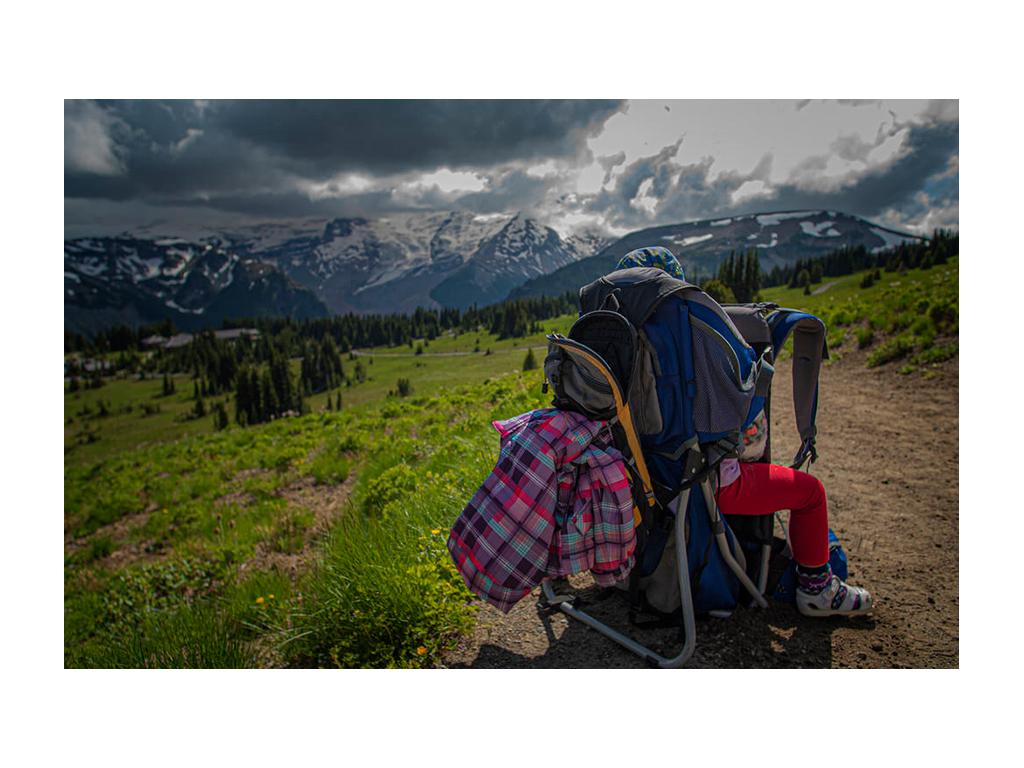 Isabelle sitting in child hiking backpack