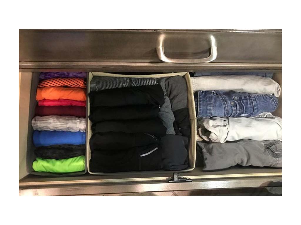 Drawer full of clothes folded using the KonMari folding method