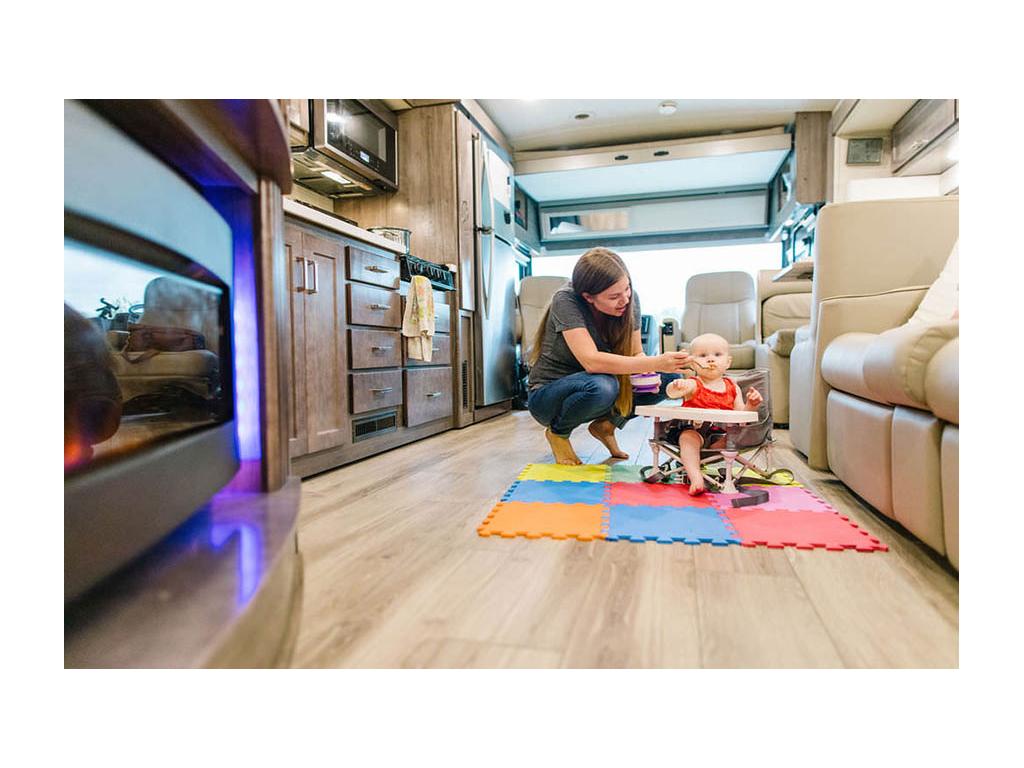 Alyssa feeding Ellie in kitchen of Forza