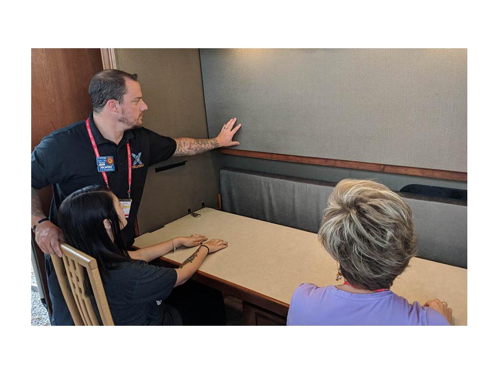 Travis and Melanie Carr testing out the desk