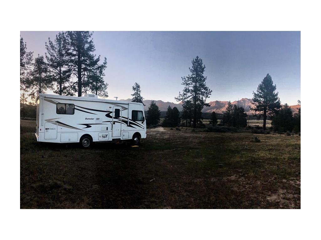 Sunstar with mountains in background