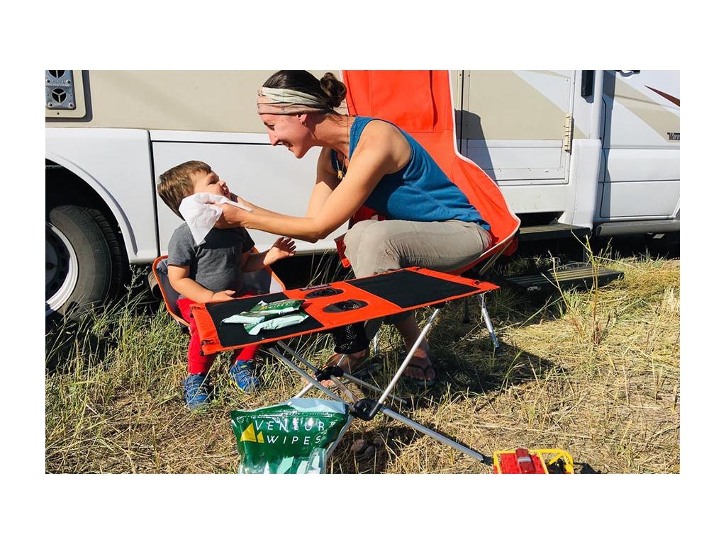 Brittany cleaning off Caspian's face while sitting outside of View