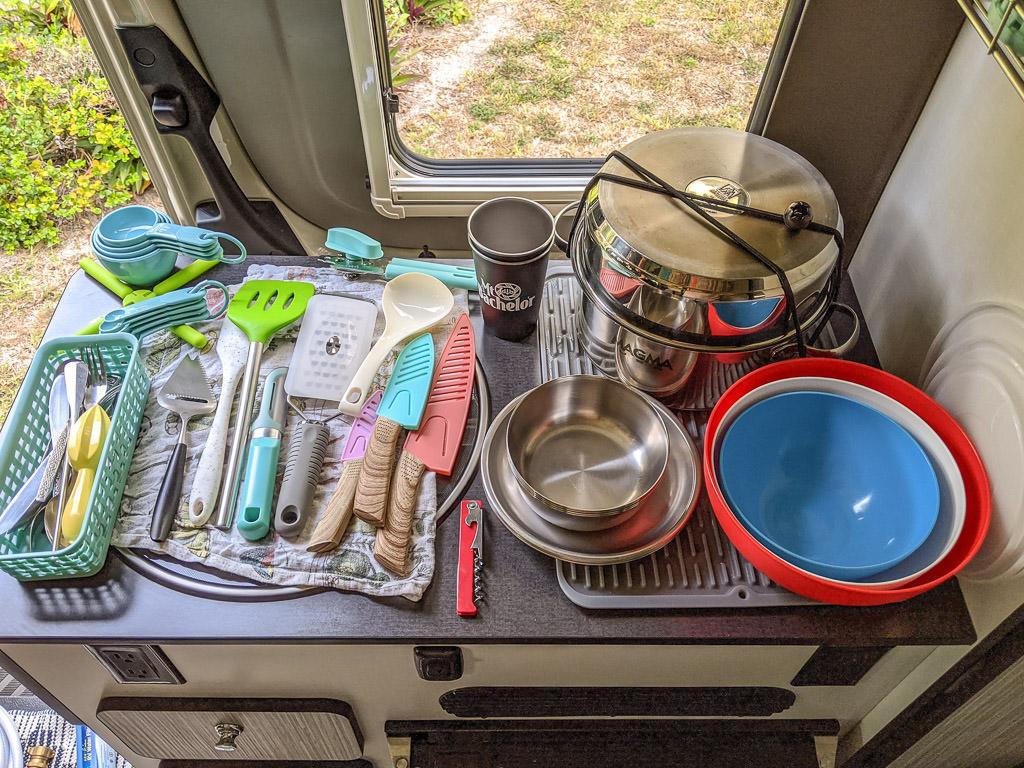 Kitchen counter full of kitchen gadgets and cookware