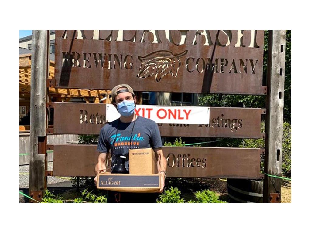 Mark holding box from Allagash Brewery in Maine