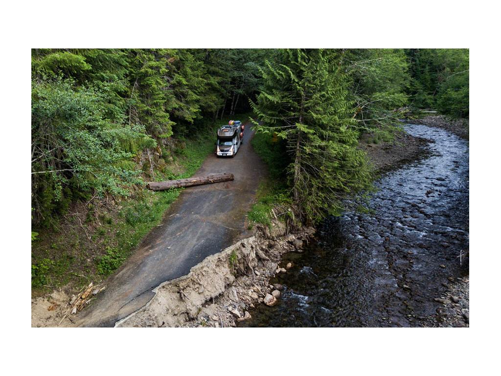 Winnebago View driving down road blocked by fallen tree