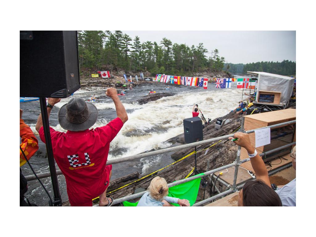 Crowd cheering on freestyle kayakers