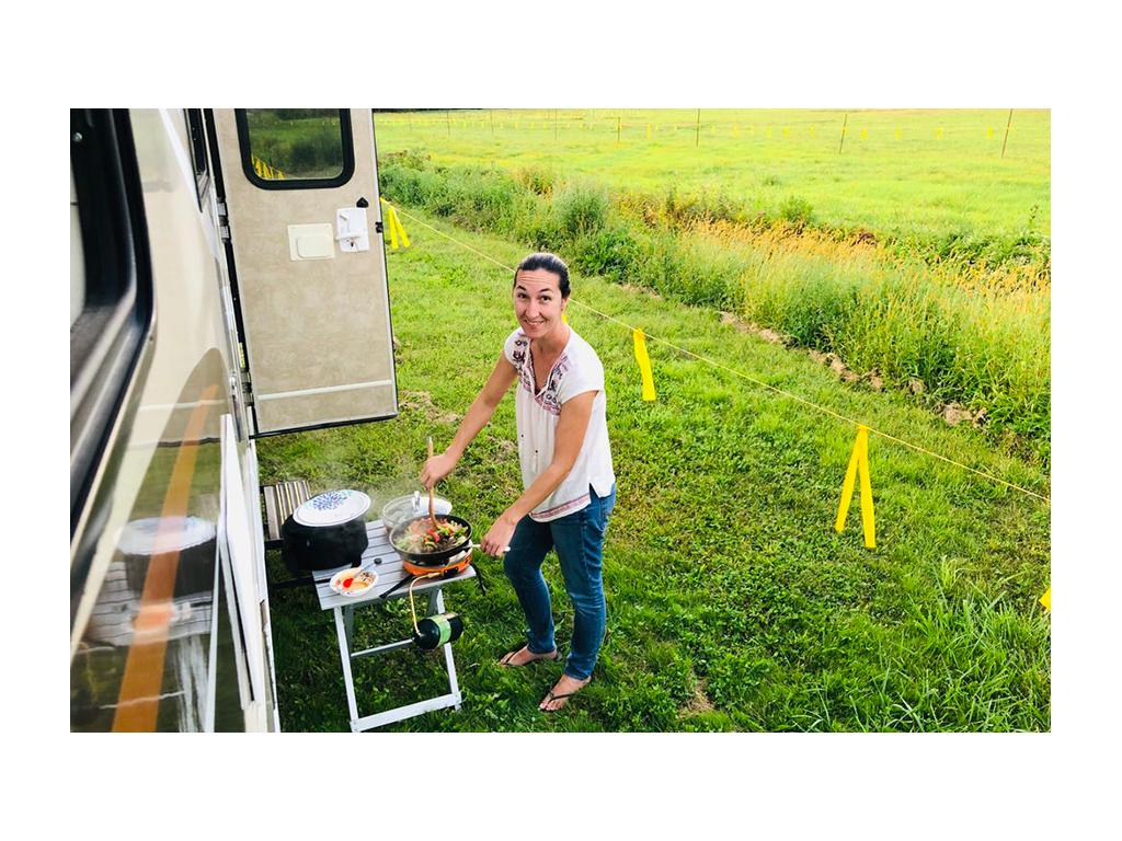 Brittany cooking outside their RV