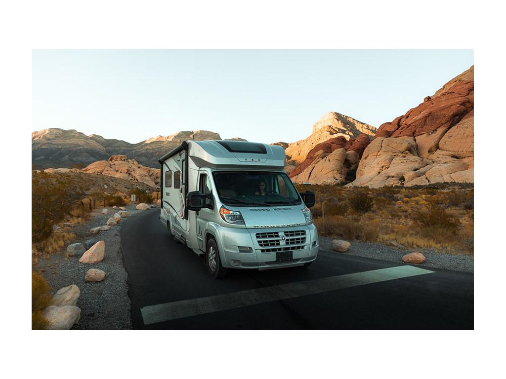 Nadia driving Trend down road surrounded by red rocks