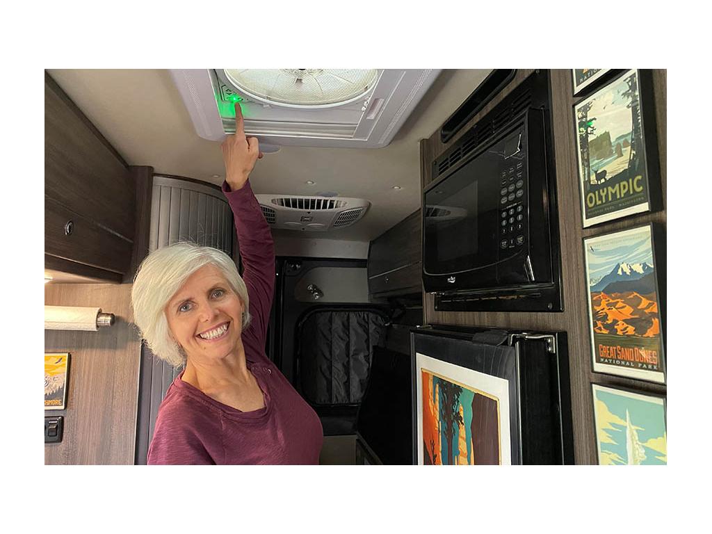 Chris pointing to power button on Maxxair fan