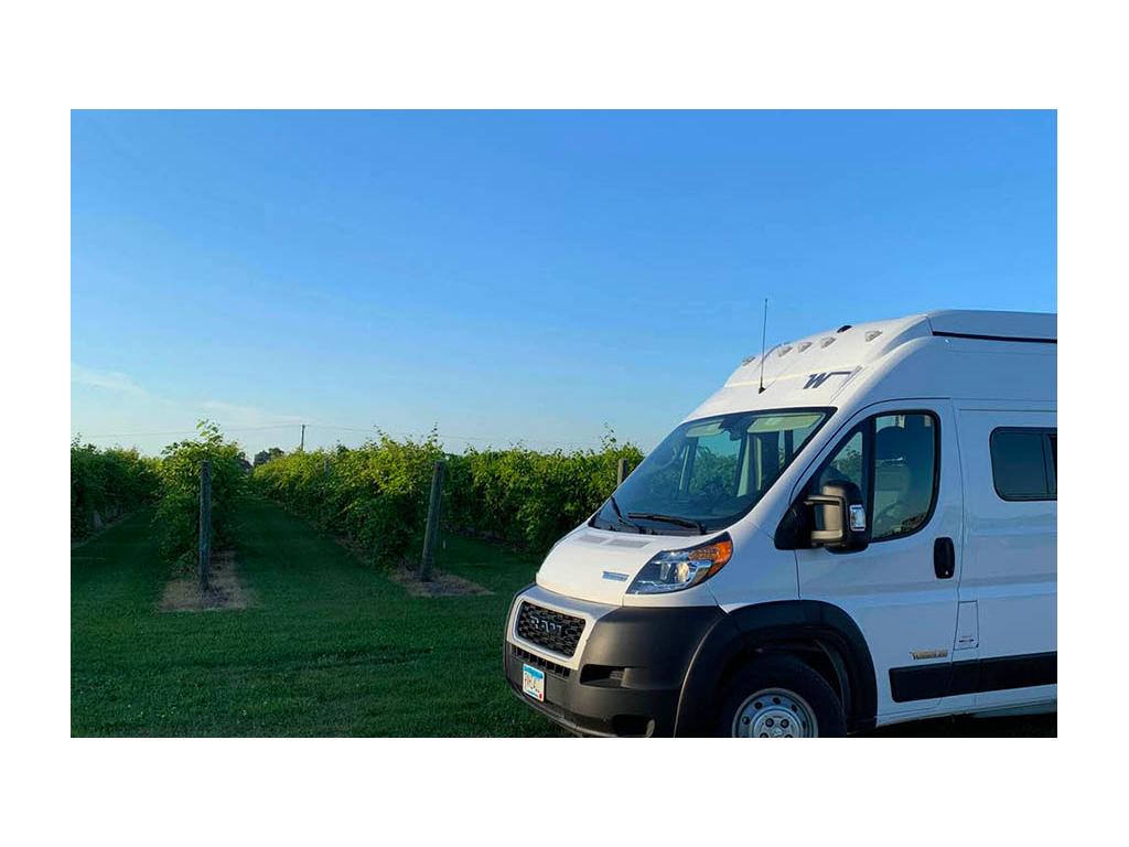 Front end of the Solis next to trees