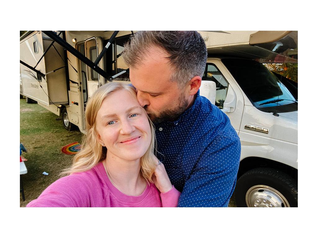 Wes kissing Tera on cheek in front of Minnie Winnie