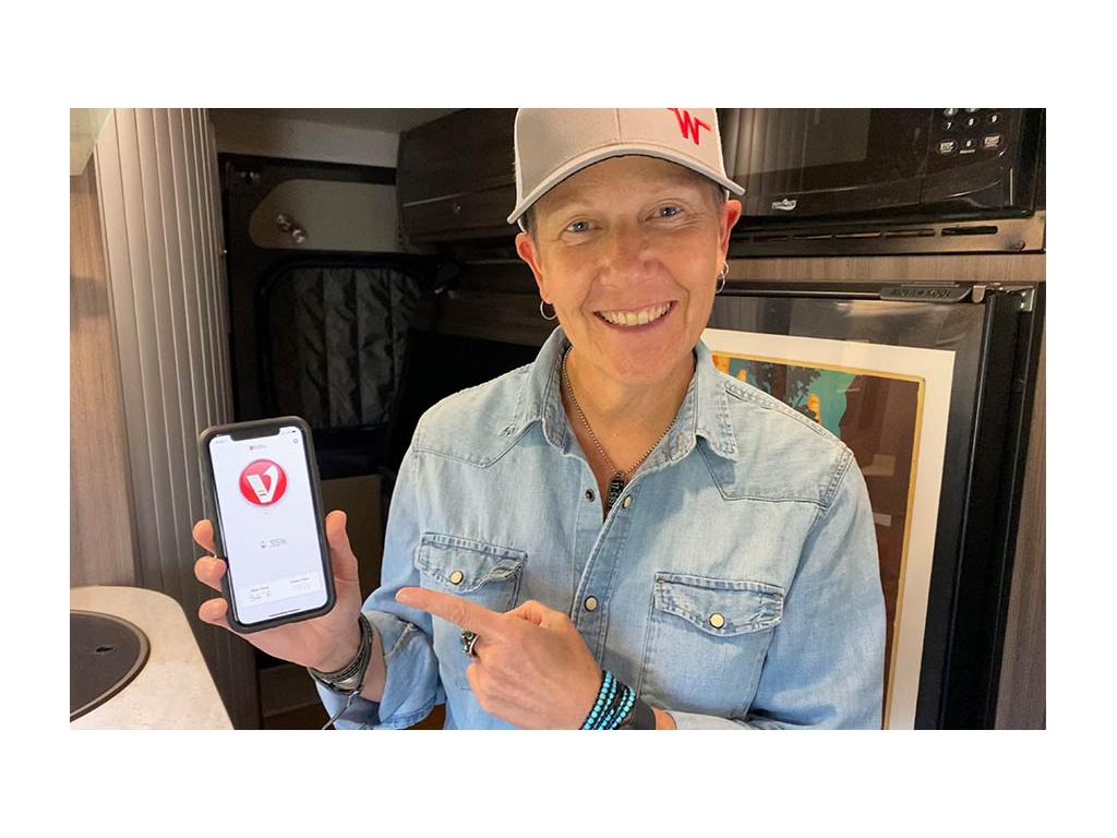 Noel showing off Volta app on phone screen