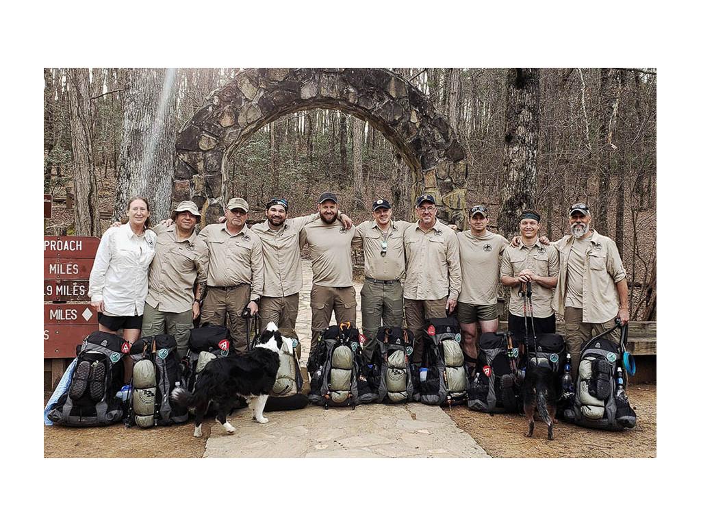 Warrior Expeditions group at trail head with gear