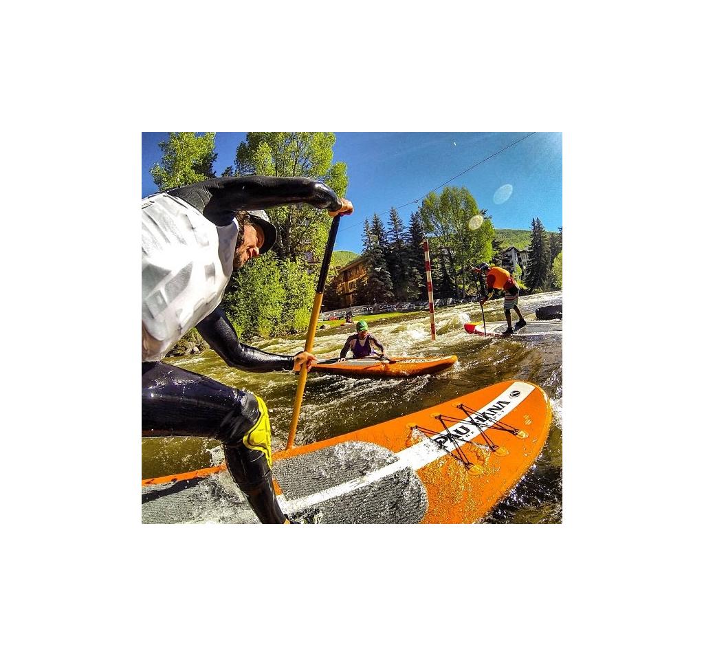 People on paddleboards in the water.