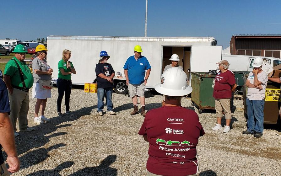 RV Care-A-Vanners standing in a circle talking