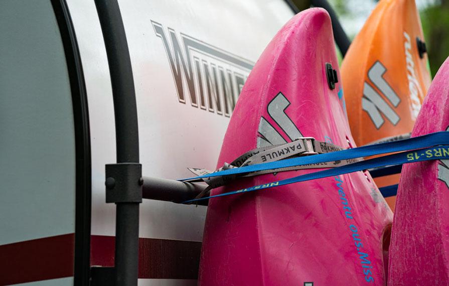 Close up shot of kayaks strapped to back of HIKE