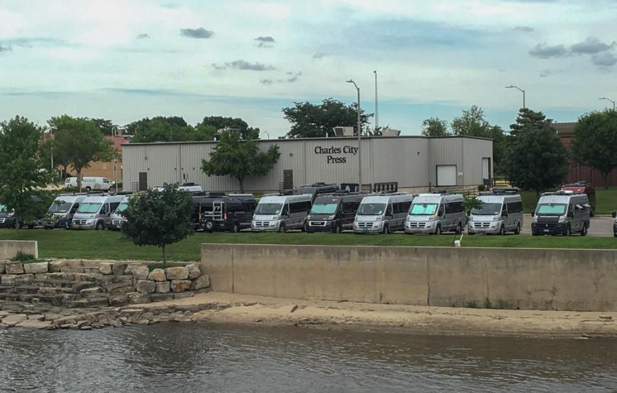 Travatos parked in a line at Charles City Press in Charles City, Iowa