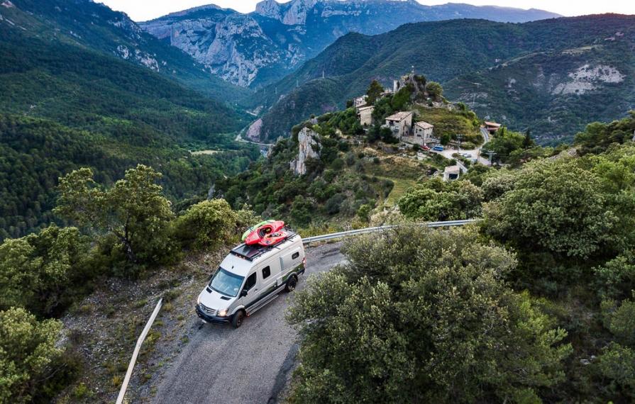 Revel driving down road with kayaks on top