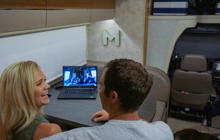 Lindsay and Dan watching their episode of Going RV