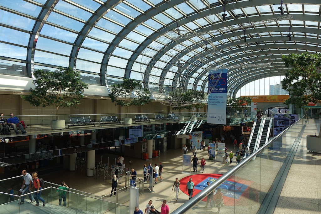 Station at Messe fairground complex with skylights covering ceiling.