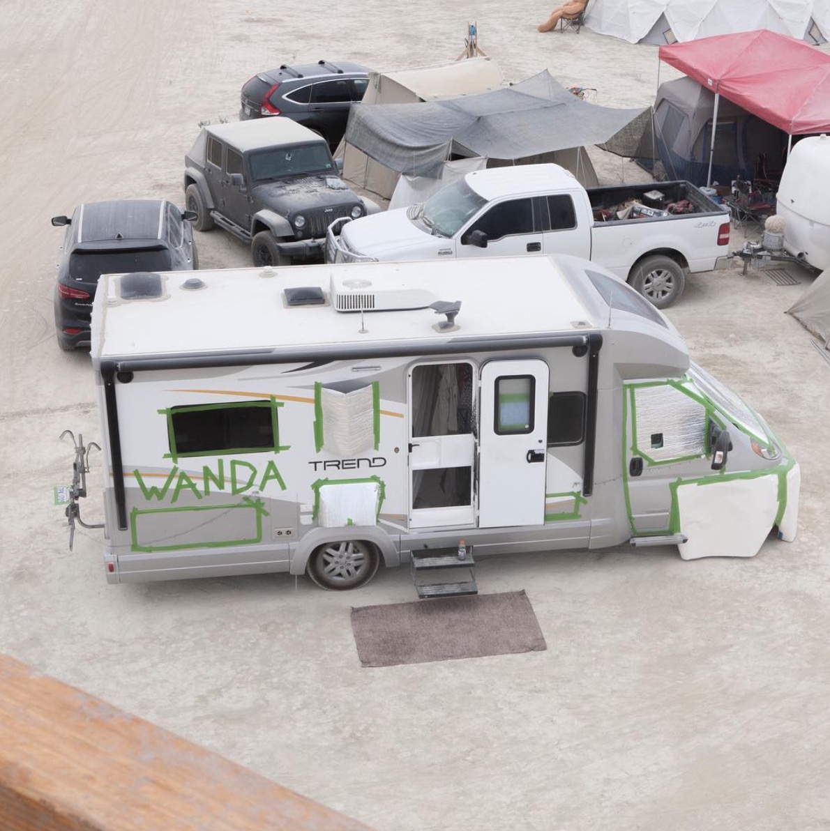 Winnebago Trend taped up preparing to be painted.