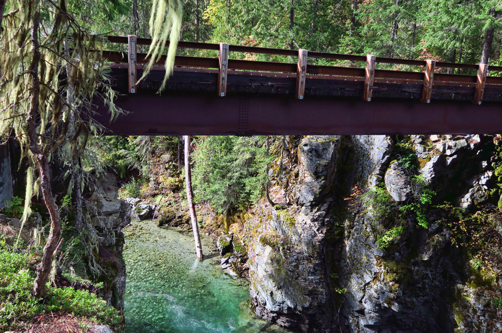 Bridge over tree lined Stehekin River.