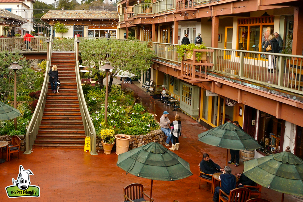 People walkingg around shops.