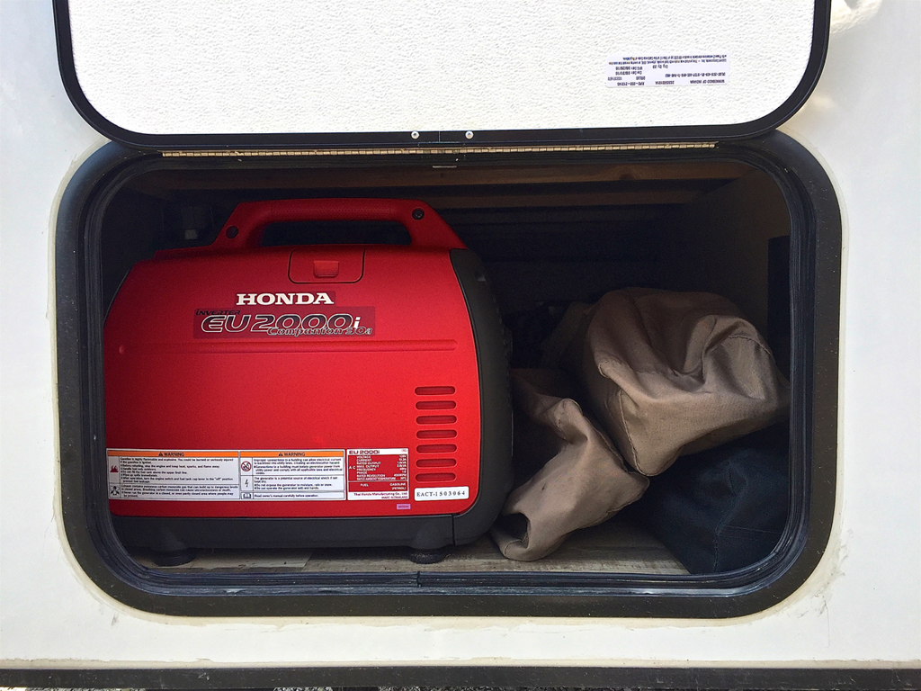 Storage compartment on the side of Winnebago Micro Minnie.