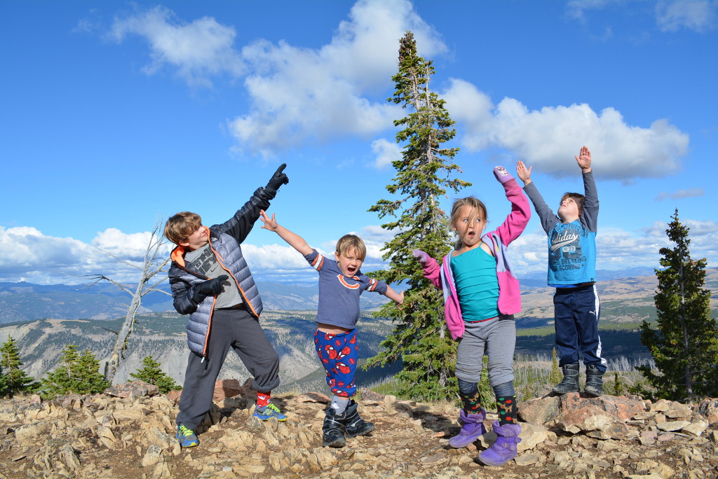 Royal kids standing on rocks posing for a silly picture