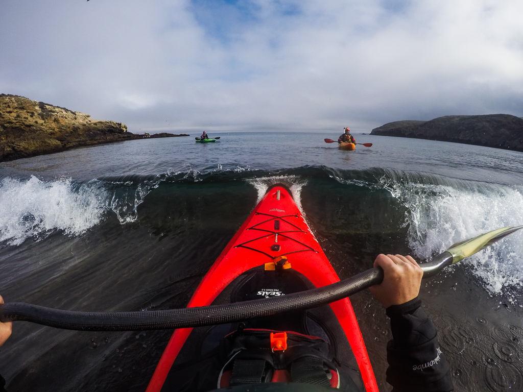 Kathy punching through a small break of water with Abby and Peter ahead of her.