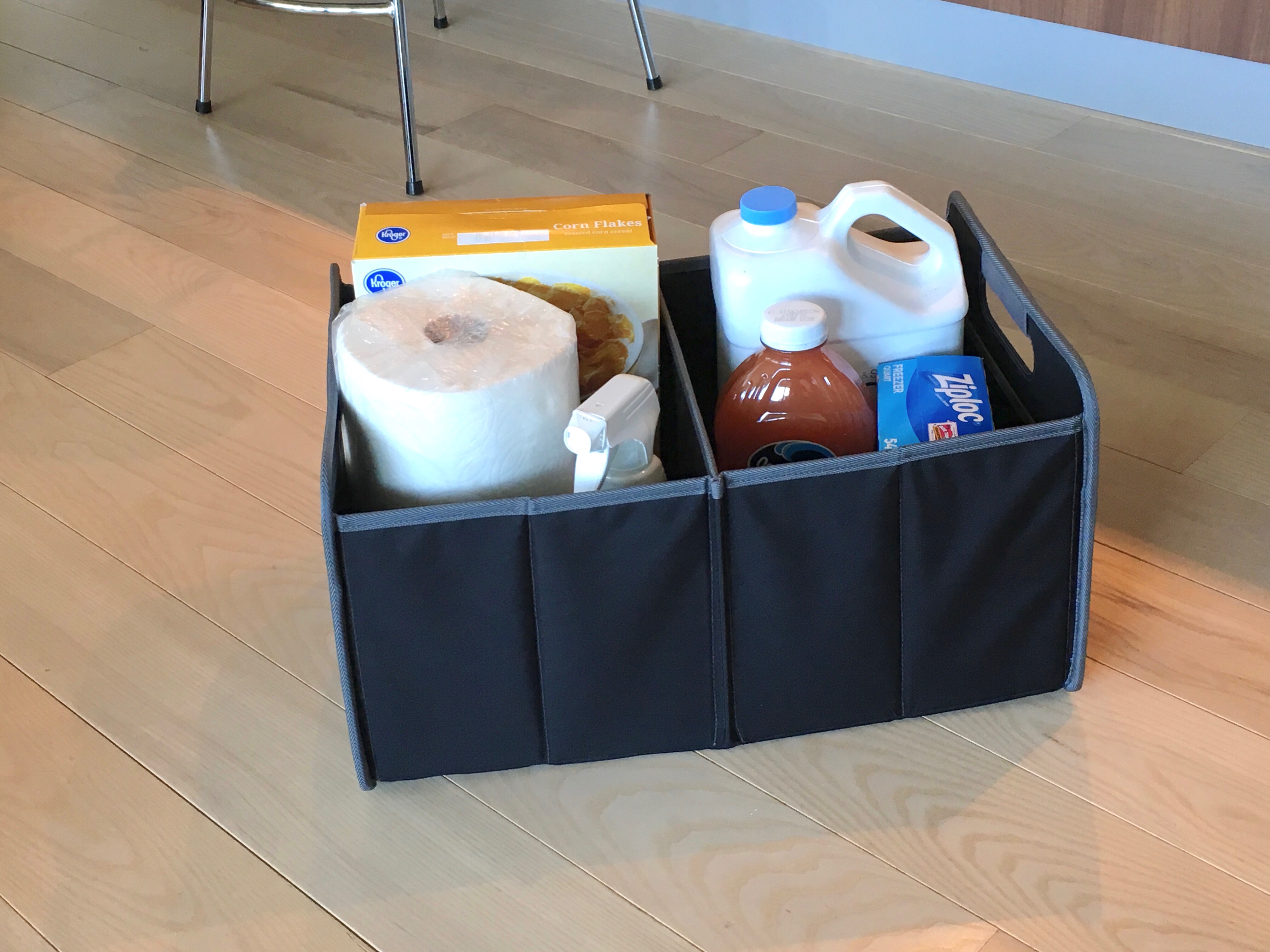 Detail view of Meori collapsible, folding box in use with various supplies