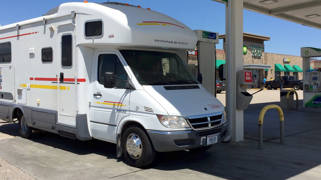 Winnebago View parked getting gas.