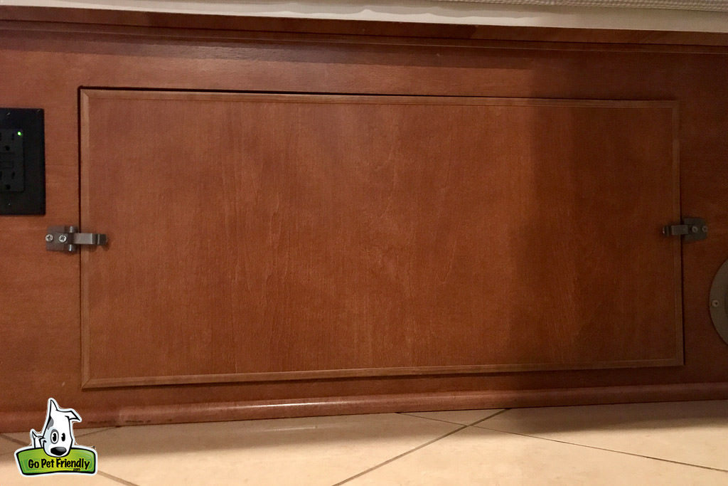 Cover for fuse panel at foot of the bed.