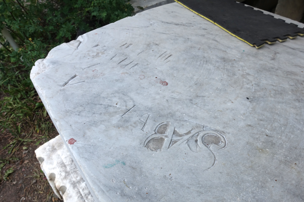 Sculpture style graffiti in marble block.