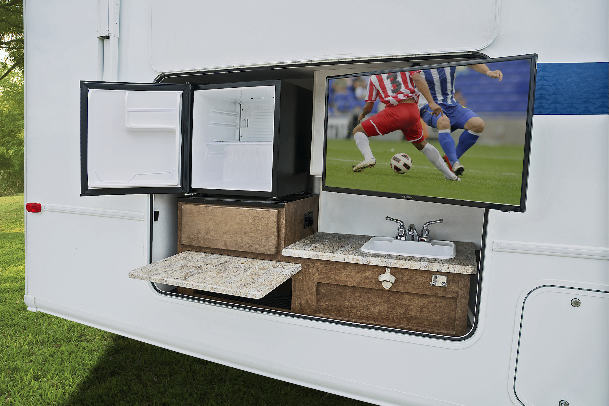 Exterior TV and kitchenette of Winnebago Intent.