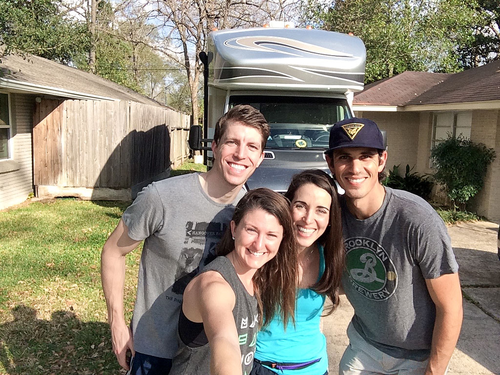Jordan and Brittany with their friends standing in front of Winnebago View.