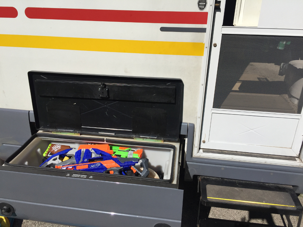 Exterior storage bin full of toys