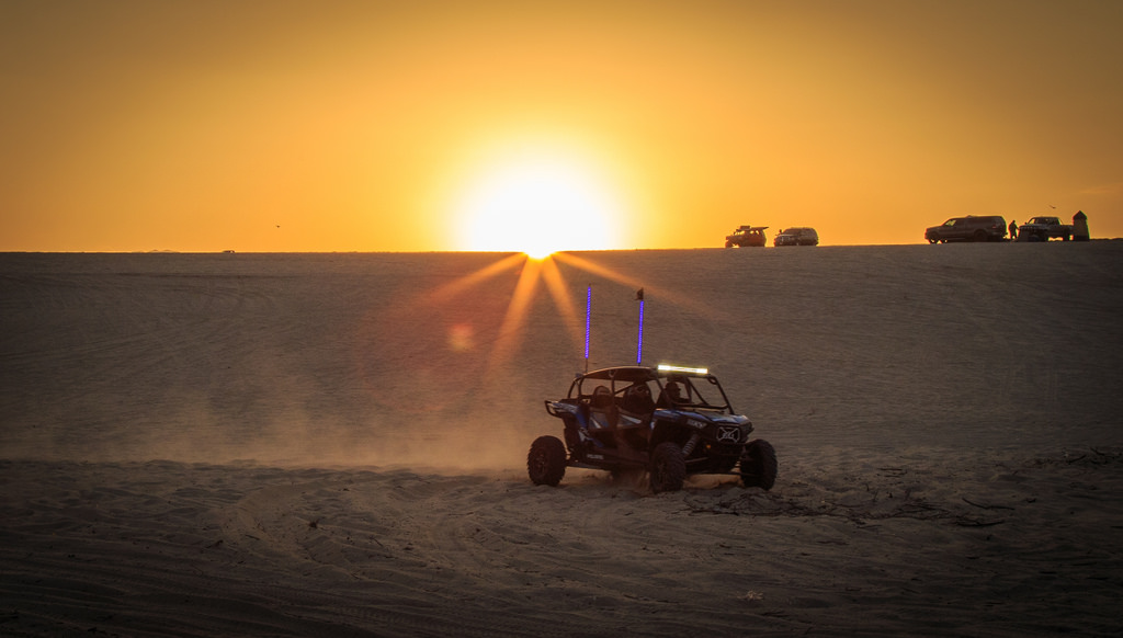 Sand buggy driving across the sand