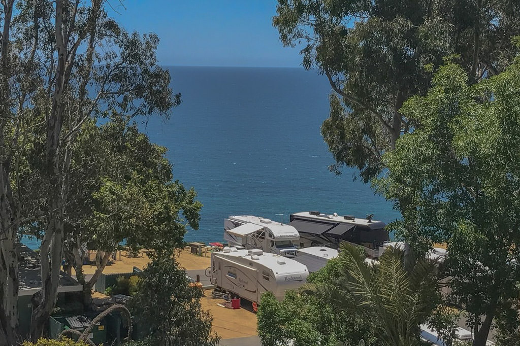 RV's parked at campground right next to the water