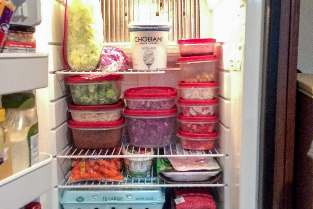 Fridge full of nicely stacked storage containers